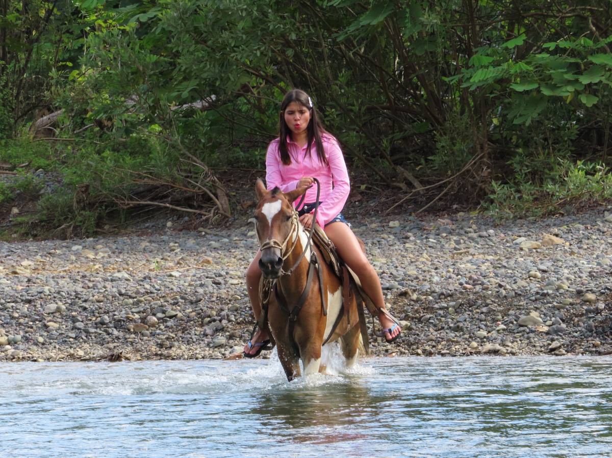 Riders on jungle trail near Jaco, Costa Rica